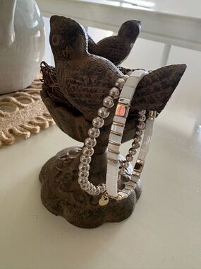 Stack of Silver and Gold White Stretch Bracelets